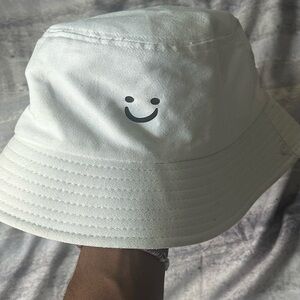 Smiling bucket hat.